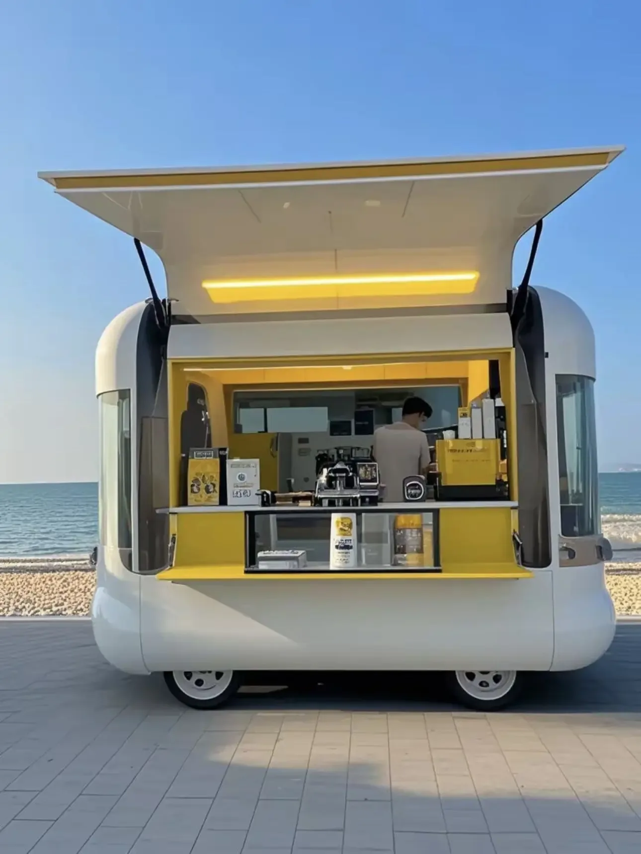 White and yellow compact coffee cart with open serving window